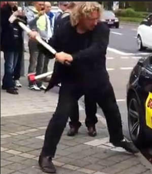 Protester smashes BMW