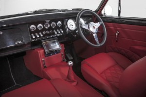 Five-speed manual gearbox and a sea of red leather