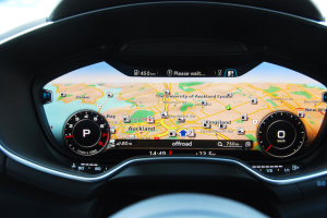 The rev counter and speedo have been minimised on the cluster to highlight the sat-nav map 