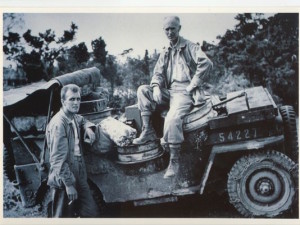 Ernie Pyle seated on a Jeep in Okinawa in 1944, not long before he was killed by fire from a Japanese machine gun