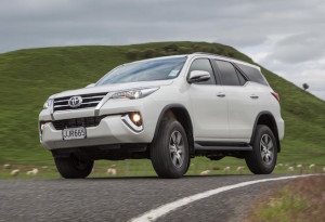 Fortuner GXL Exterior - Crystal Pearl - front three quarter driving on the open road option two