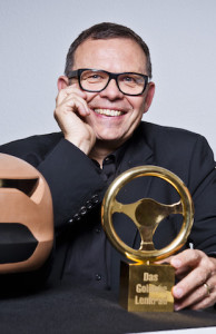 Kia design chief Peter Schreyer with Germany's Golden Steering Wheel award