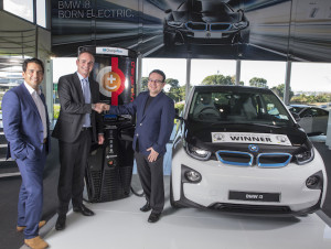 Transport Minister Simon Bridges, BMW NZ chief Florian Renndorfer, and Charge Net NZ's Steve West